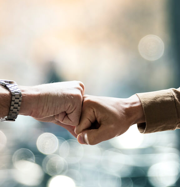 People fist bumping